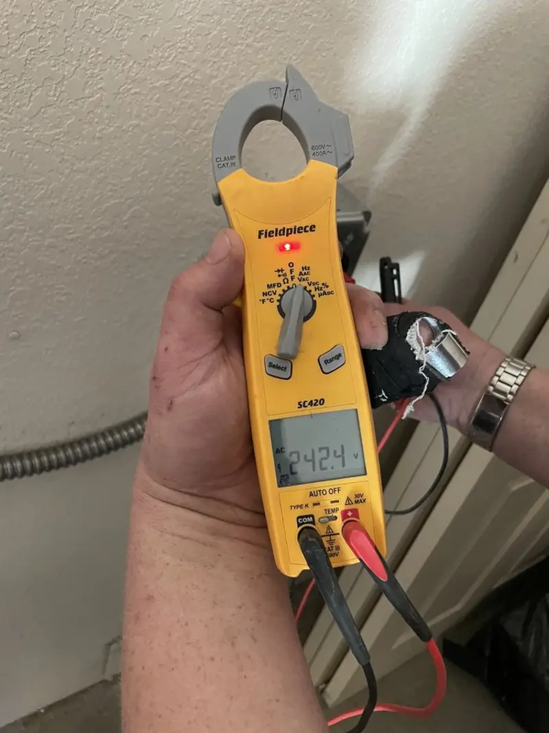 Voltage testing with clamp meter during Recessed Lighting Installation in Moxee